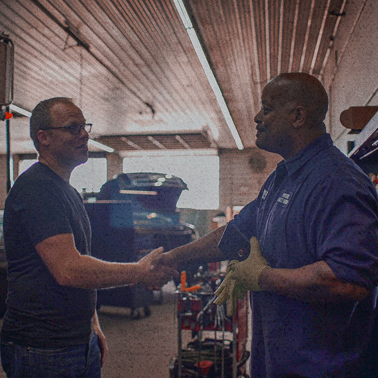 image of 2 men shaking hands - teambuilding